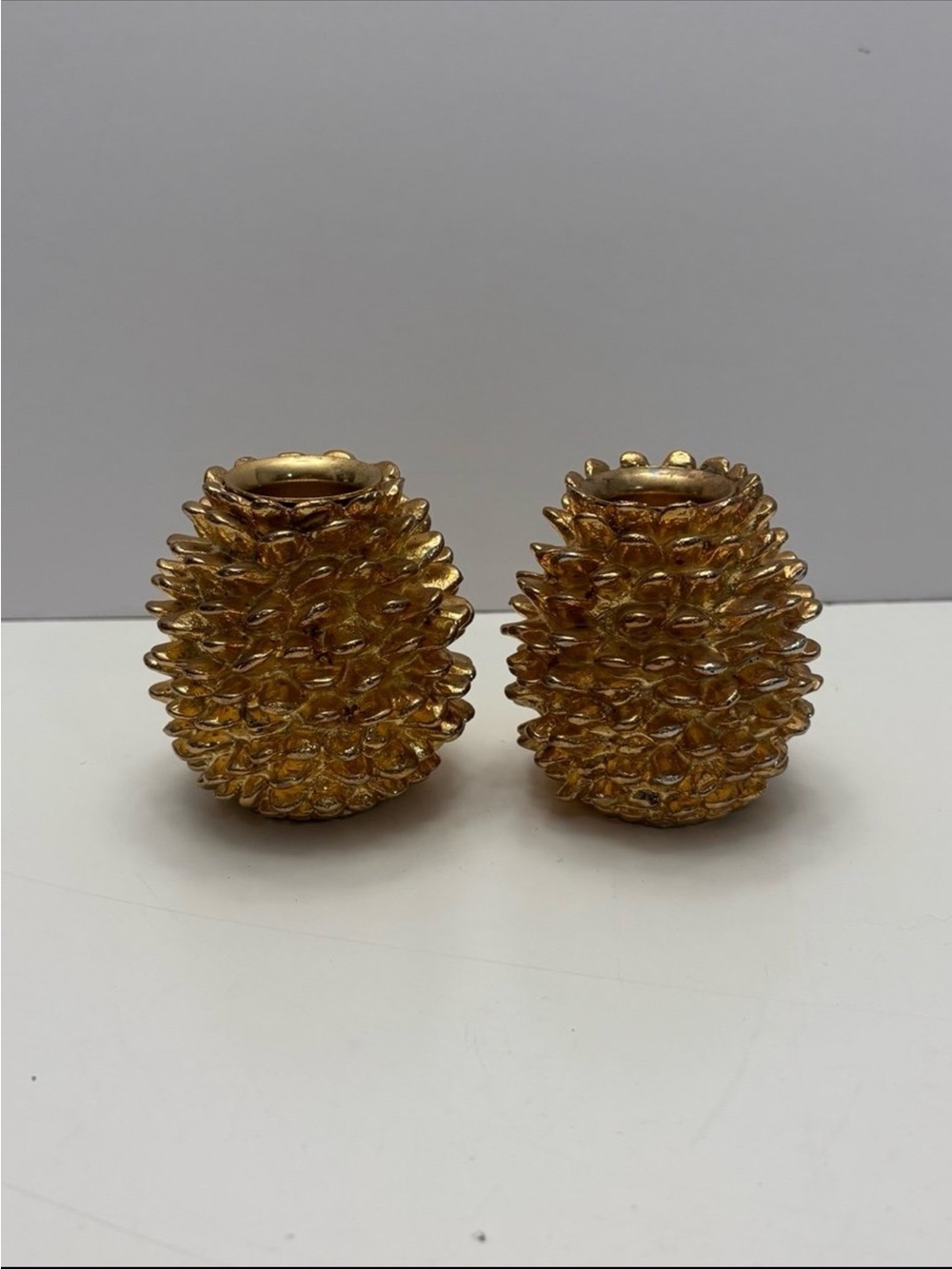 Department 56 pair of gold-toned pinecone taper candle holders